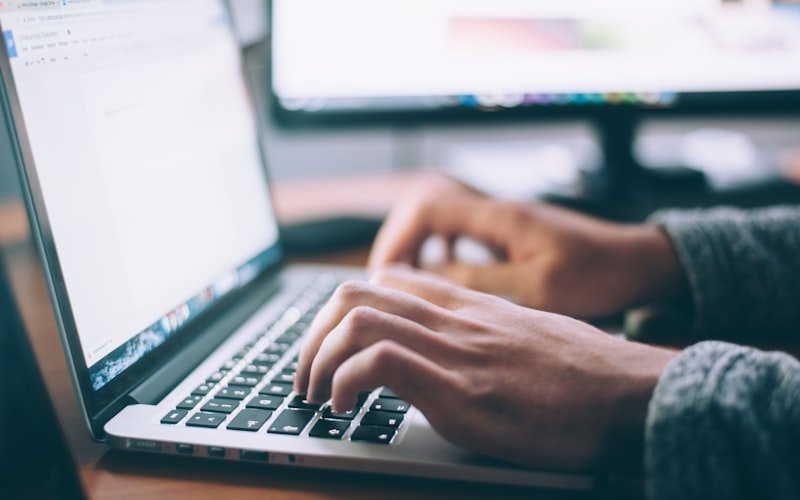 Laptop open on a contact / communication page